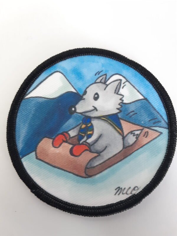Badge de camp d'hiver louveteau sur luge